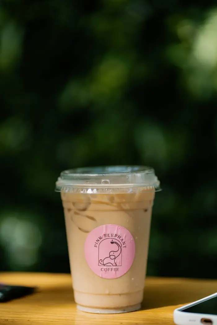 An iced coffee on a wooden table
