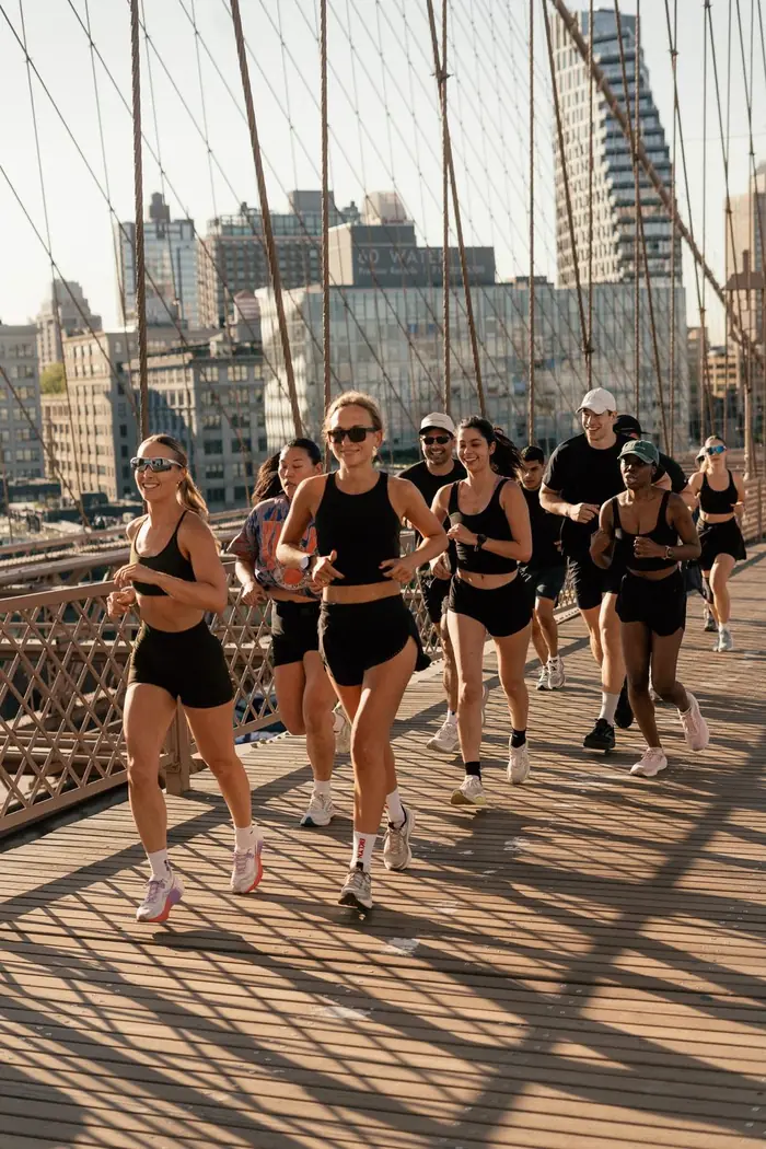 A group running across the Brooklyn Bridge